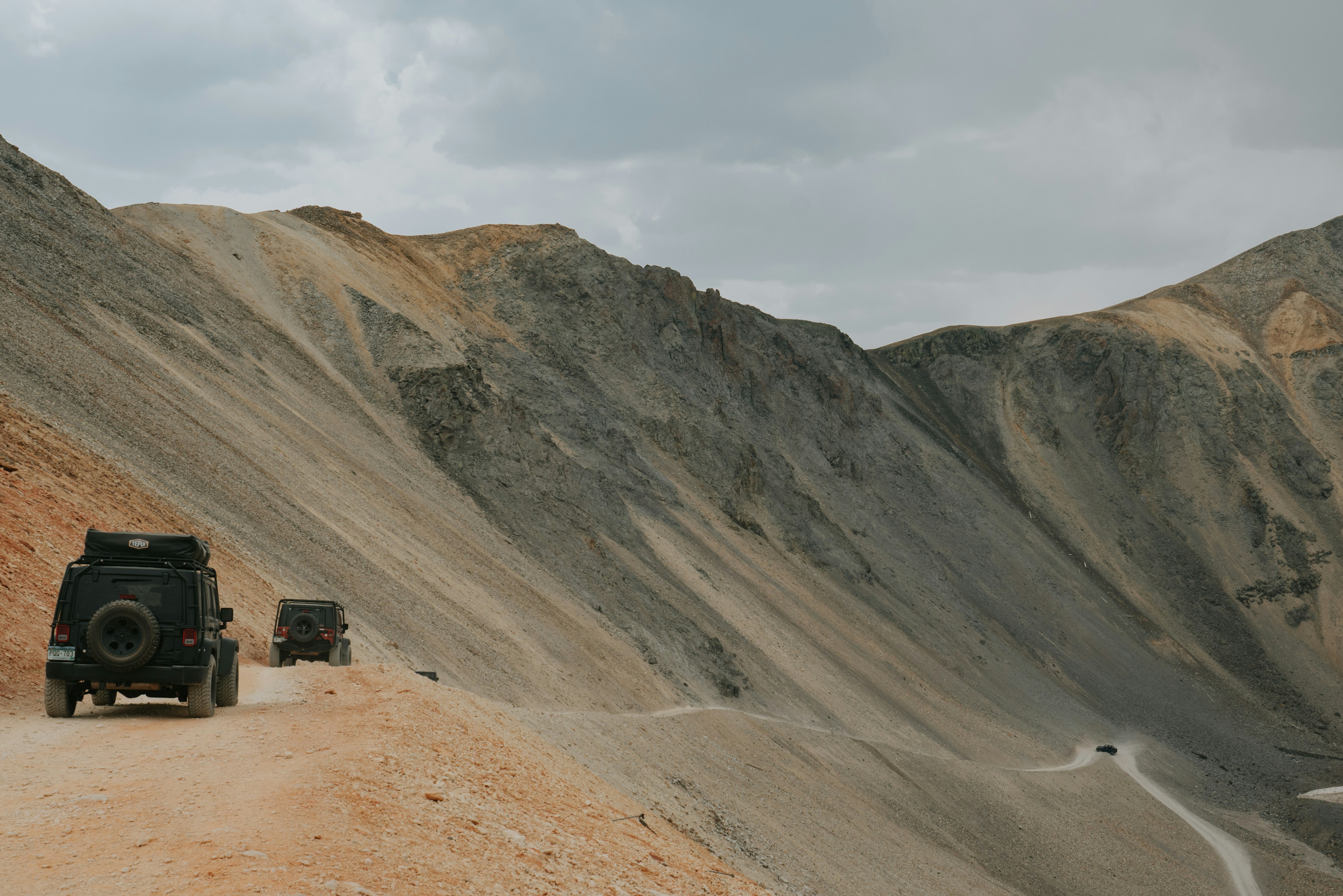 Jeeps traversing high mountain pass in Northern Pakistan